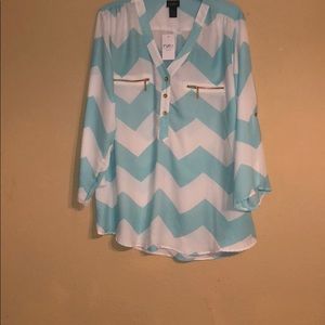 Blue and white chevron patterned shirt.